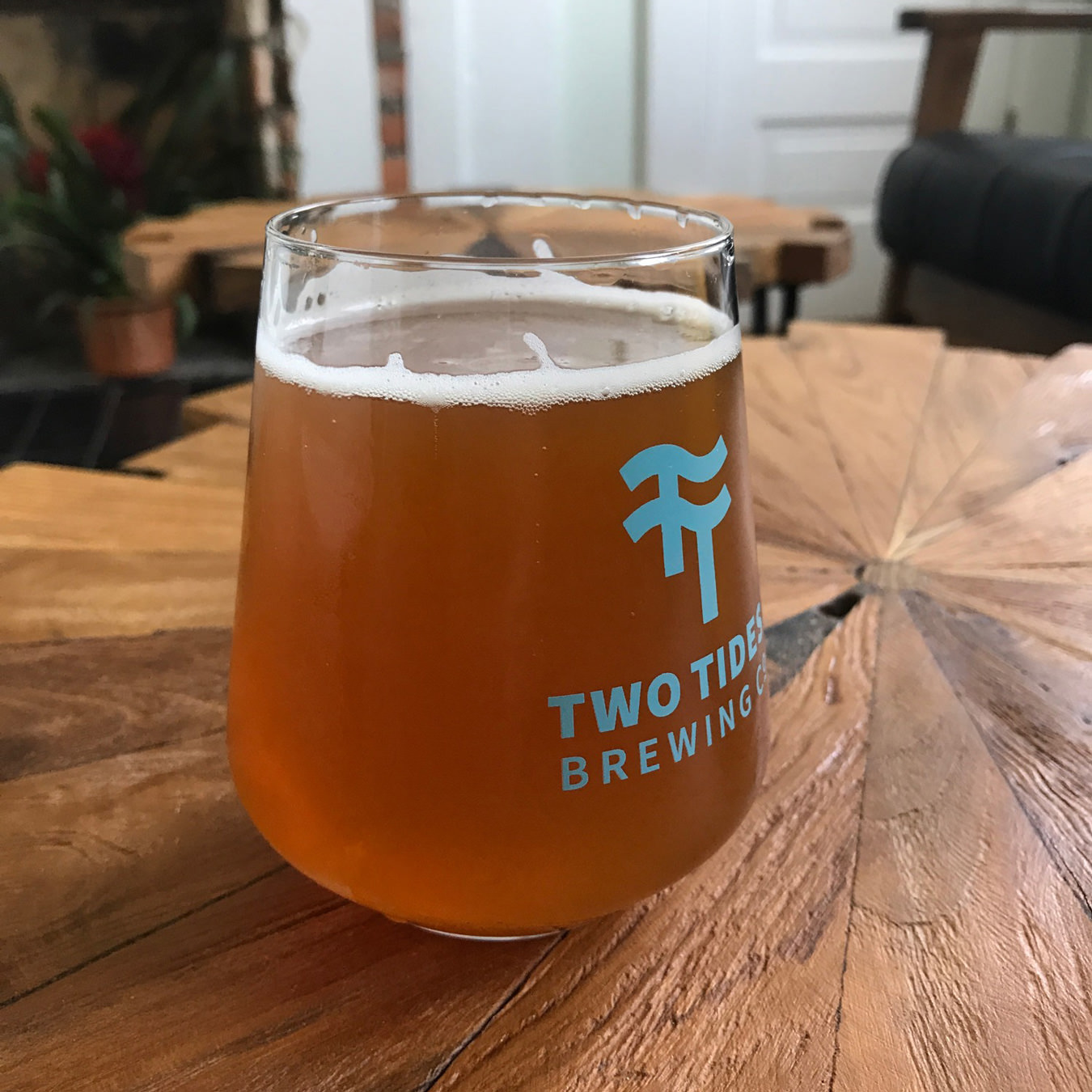 A photograph of the standard Two Tides Brewing Co. glass.