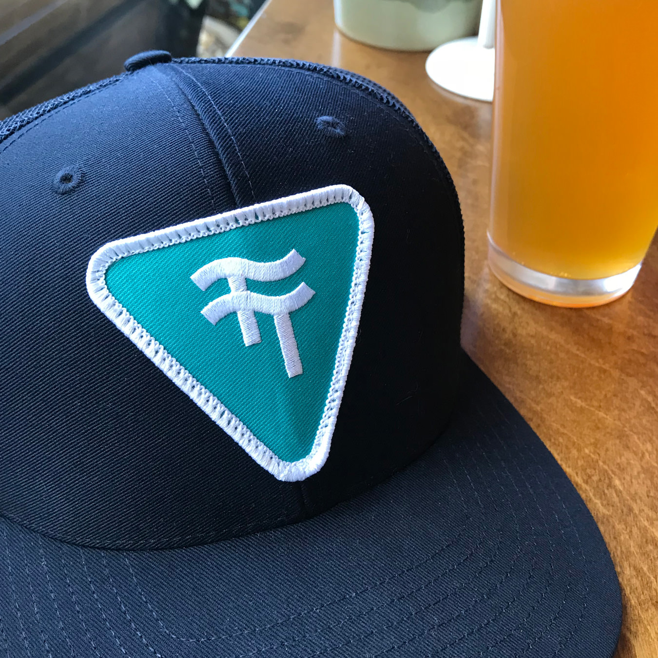 A photograph of a Two Tides Brewing Co. hat.